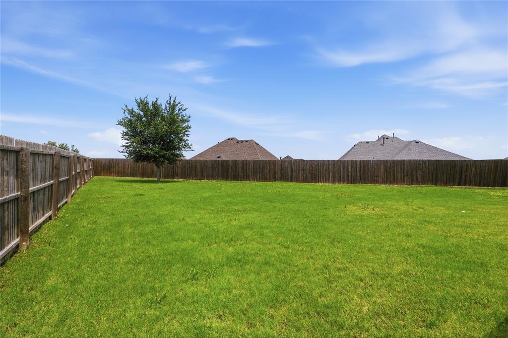 10101 Travis Road Little Elm, TX 75068 - Photo 25 of 26 a view of green field with grass