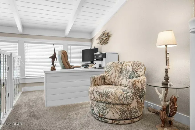 a bedroom with a large bed and a large window