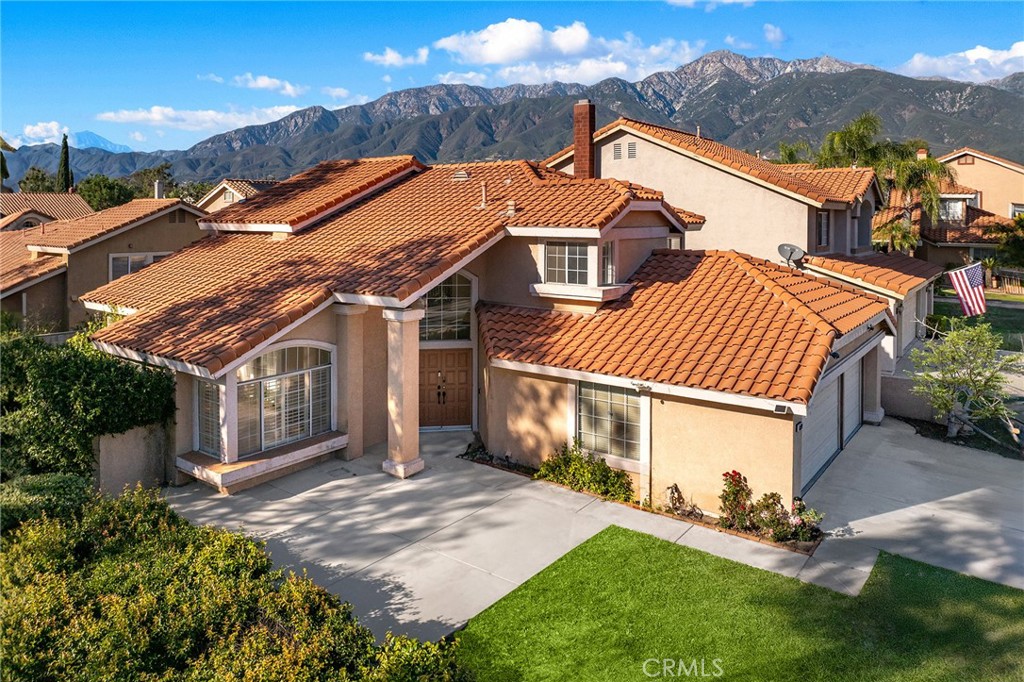 6598 Bradford Court Rancho Cucamonga, CA 91701 - Photo 1 of 48 a front view of a house with a yard