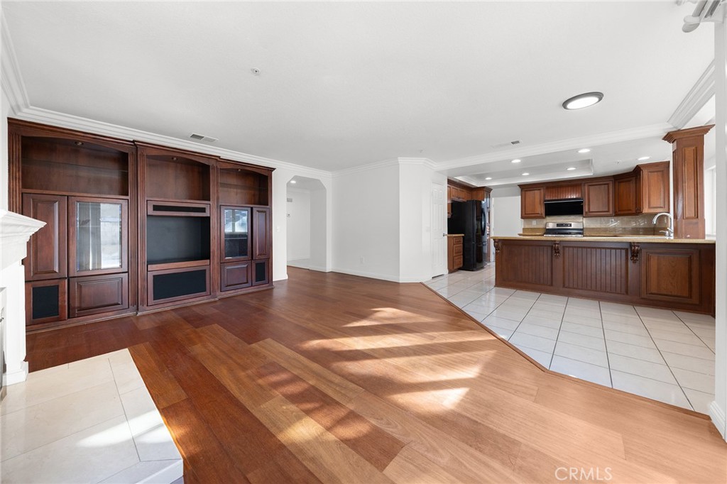 6598 Bradford Court Rancho Cucamonga, CA 91701 - Photo 17 of 48 a room with stainless steel appliances kitchen island granite countertop a refrigerator and a stove top oven