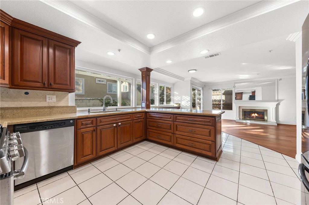 6598 Bradford Court Rancho Cucamonga, CA 91701 - Photo 20 of 48 a kitchen with stainless steel appliances granite countertop a sink and cabinets