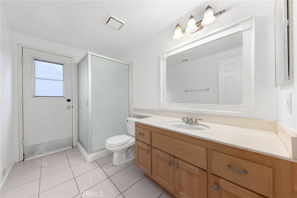 6598 Bradford Court Rancho Cucamonga, CA 91701 - Photo 24 of 48 a spacious bathroom with a sink a toilet and a mirror
