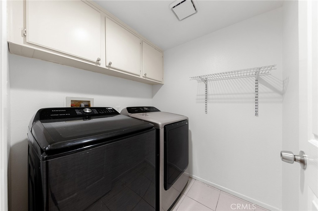 6598 Bradford Court Rancho Cucamonga, CA 91701 - Photo 25 of 48 a view of storage and utility room with washer and dryer