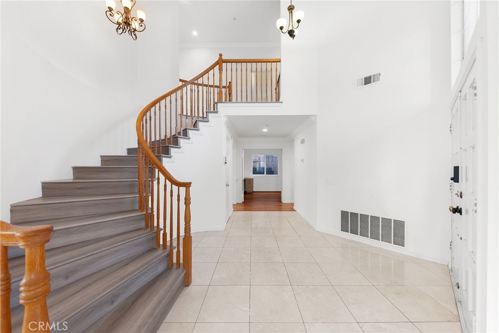6598 Bradford Court Rancho Cucamonga, CA 91701 - Photo 26 of 48 a view of a hallway with staircase