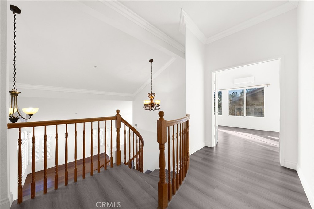 6598 Bradford Court Rancho Cucamonga, CA 91701 - Photo 29 of 48 a view of staircase with wooden floor