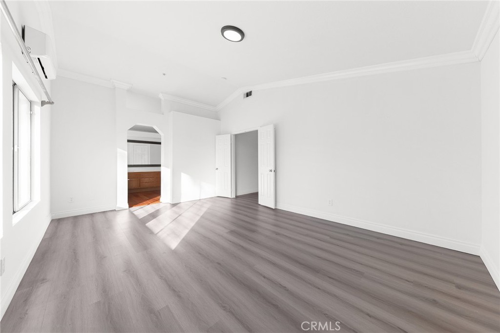 6598 Bradford Court Rancho Cucamonga, CA 91701 - Photo 31 of 48 a view of empty room with wooden floor and window