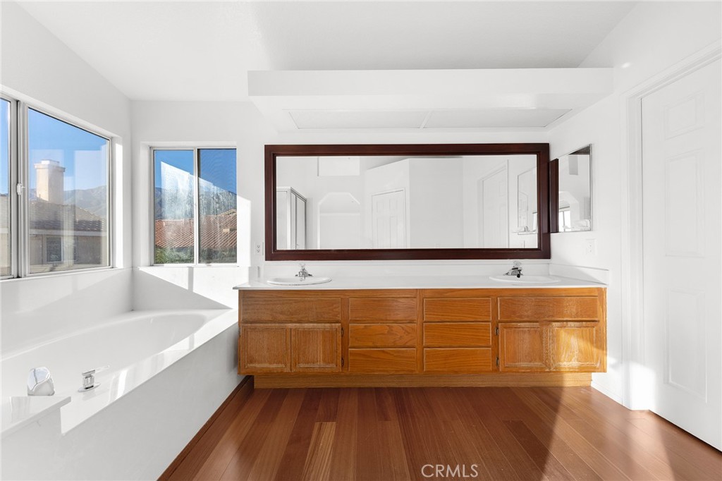 6598 Bradford Court Rancho Cucamonga, CA 91701 - Photo 32 of 48 a bathroom with a bathtub and a window