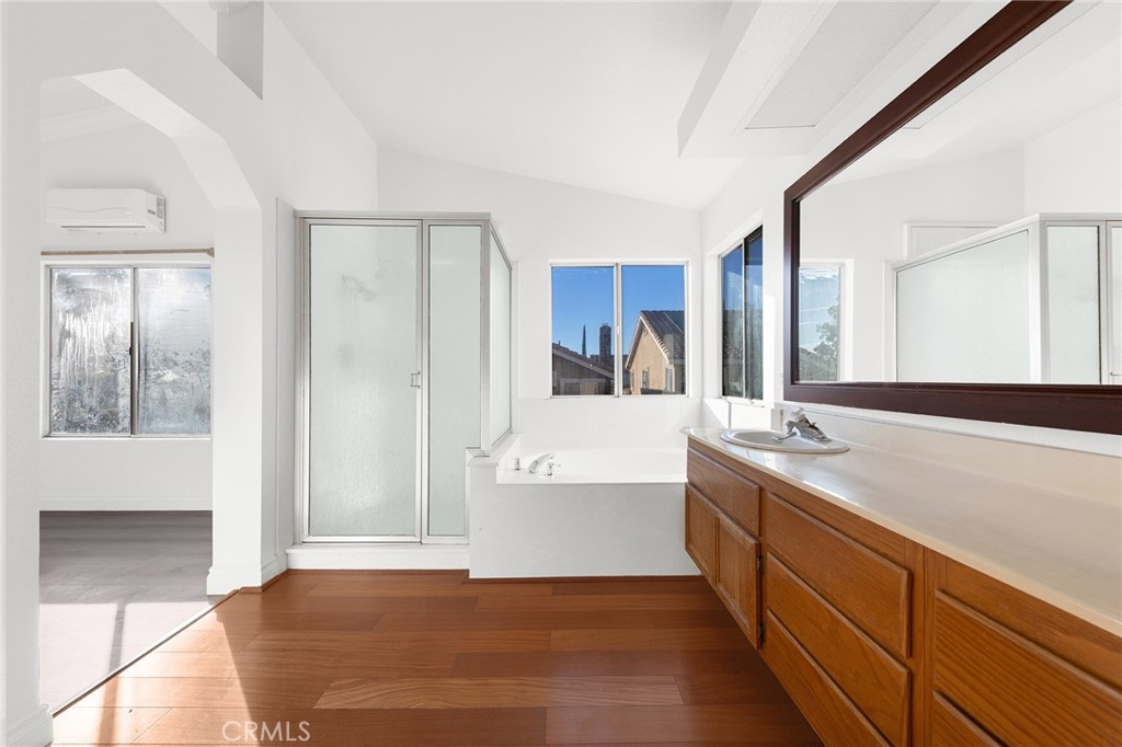 6598 Bradford Court Rancho Cucamonga, CA 91701 - Photo 33 of 48 a spacious bathroom with a tub sink and mirror