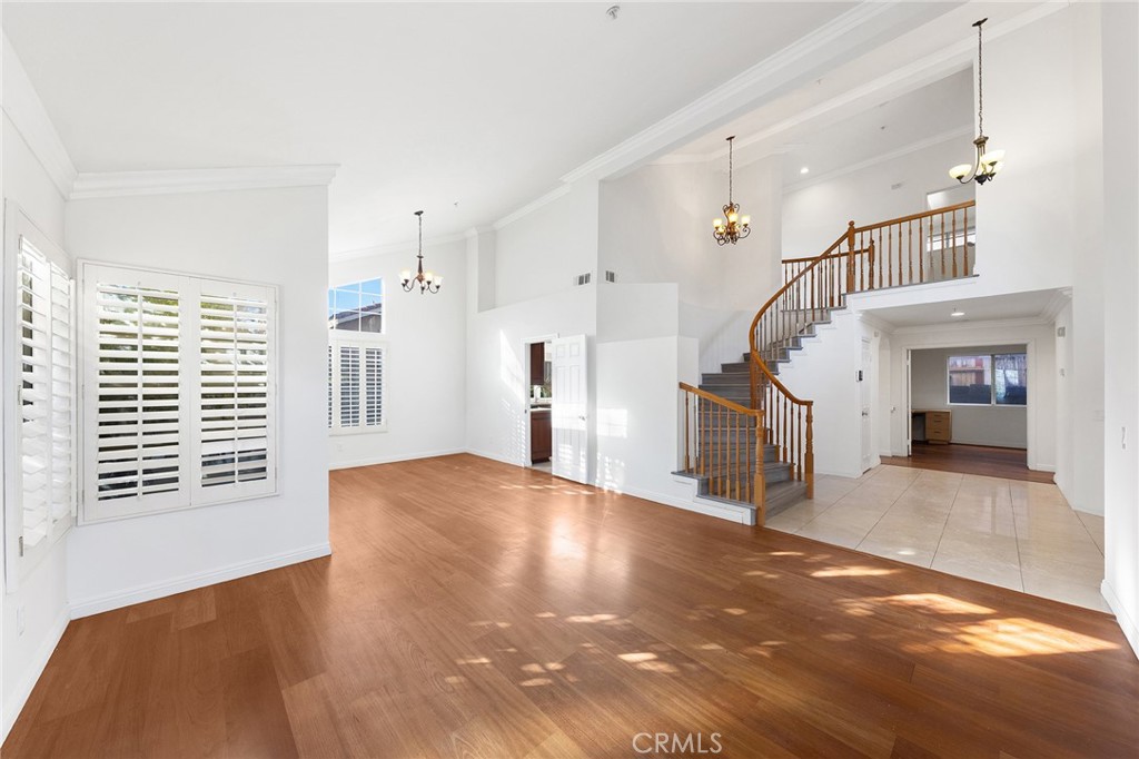 6598 Bradford Court Rancho Cucamonga, CA 91701 - Photo 9 of 48 a view of a livingroom with wooden floor and stairs