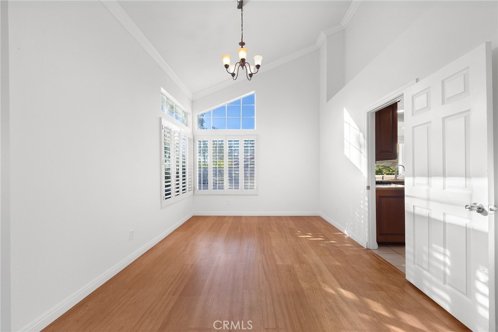 6598 Bradford Court Rancho Cucamonga, CA 91701 - Photo 10 of 48 a view of a room with window and wooden floor