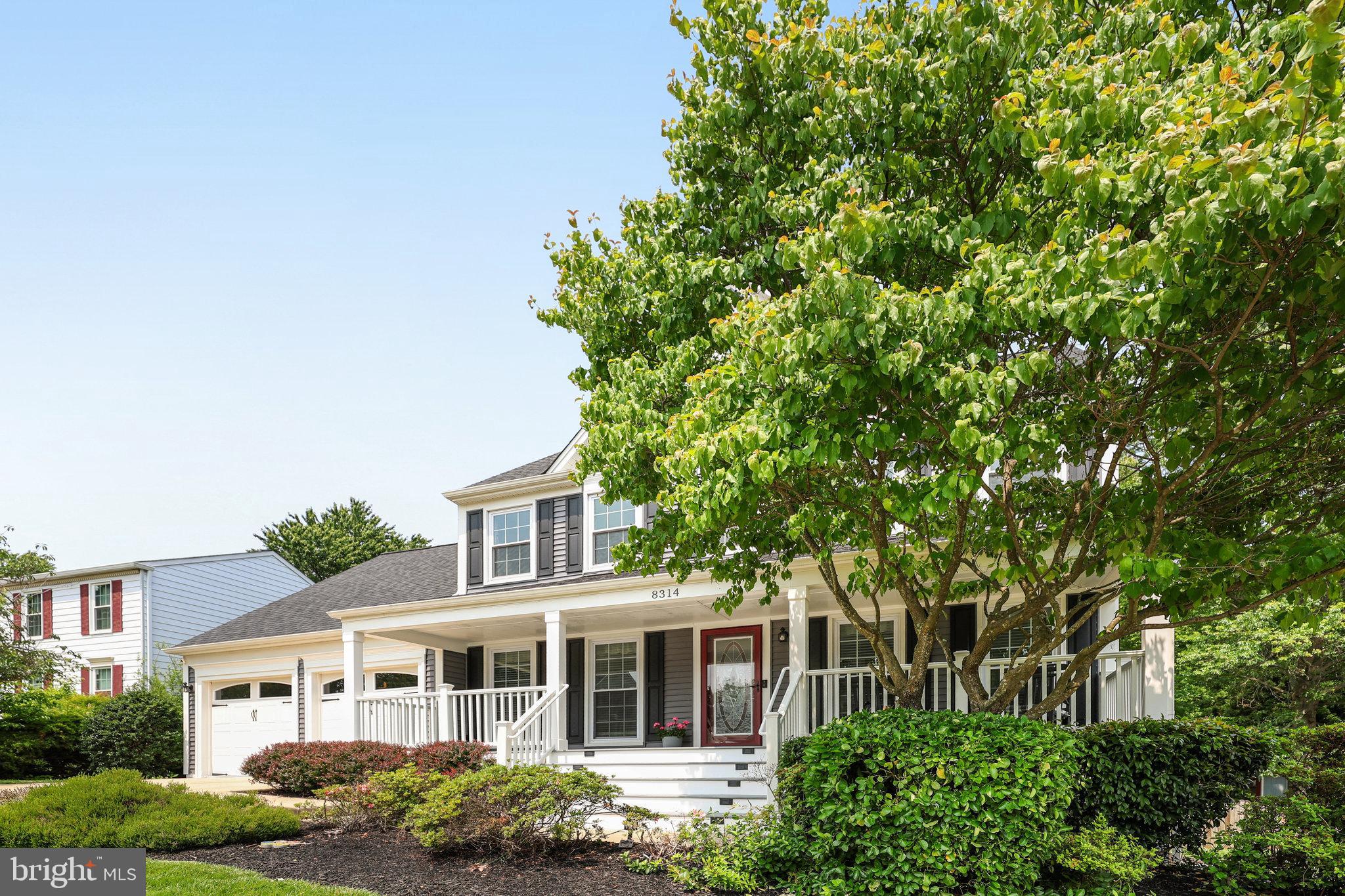 8314 Graceway Drive Lorton, VA 22079 - Photo 2 of 64 front view of a house with a garden