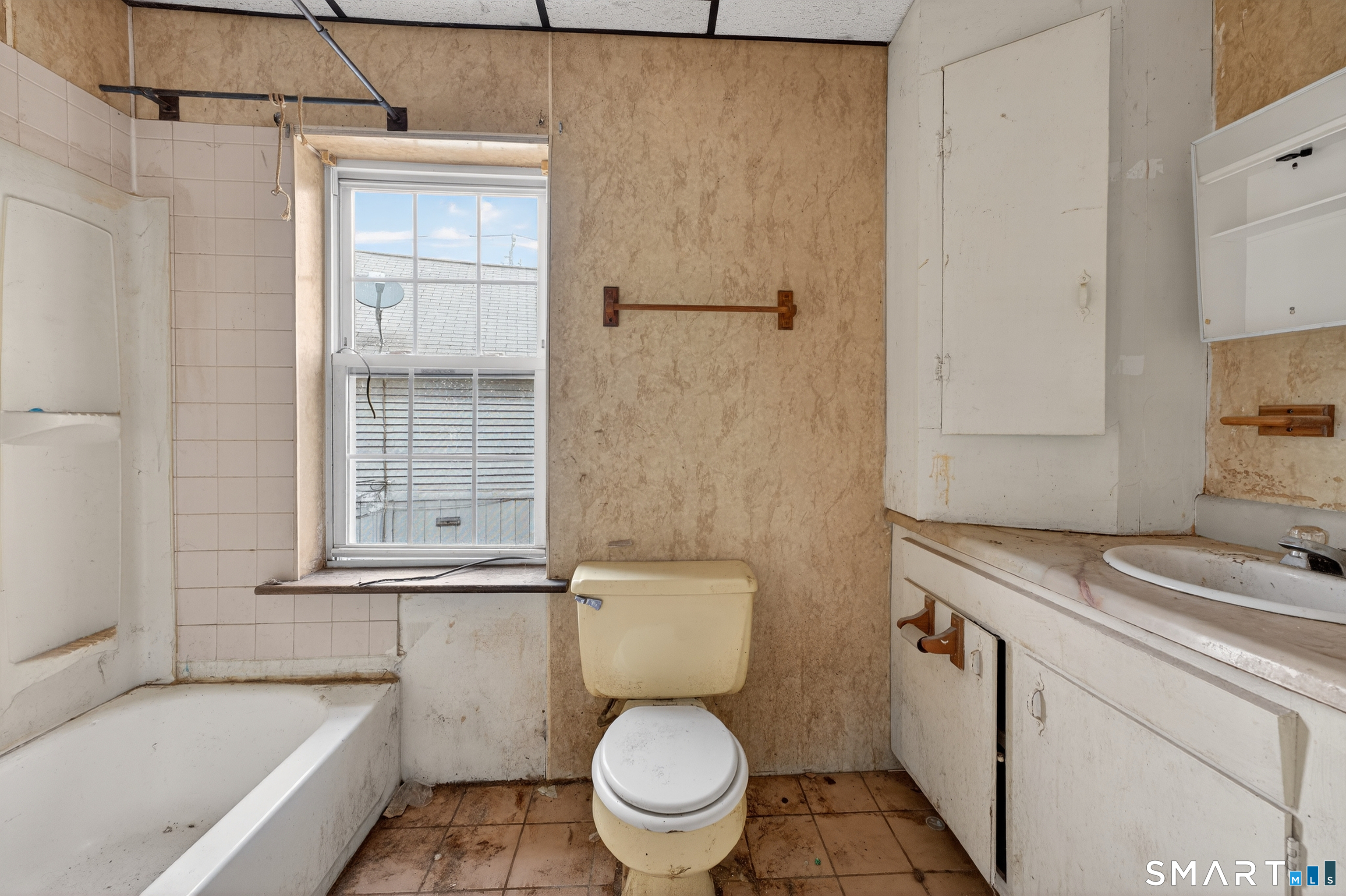 259 Yantic Street Norwich, CT 06360 - Photo 13 of 19 a bathroom with a granite countertop toilet a sink and bathtub