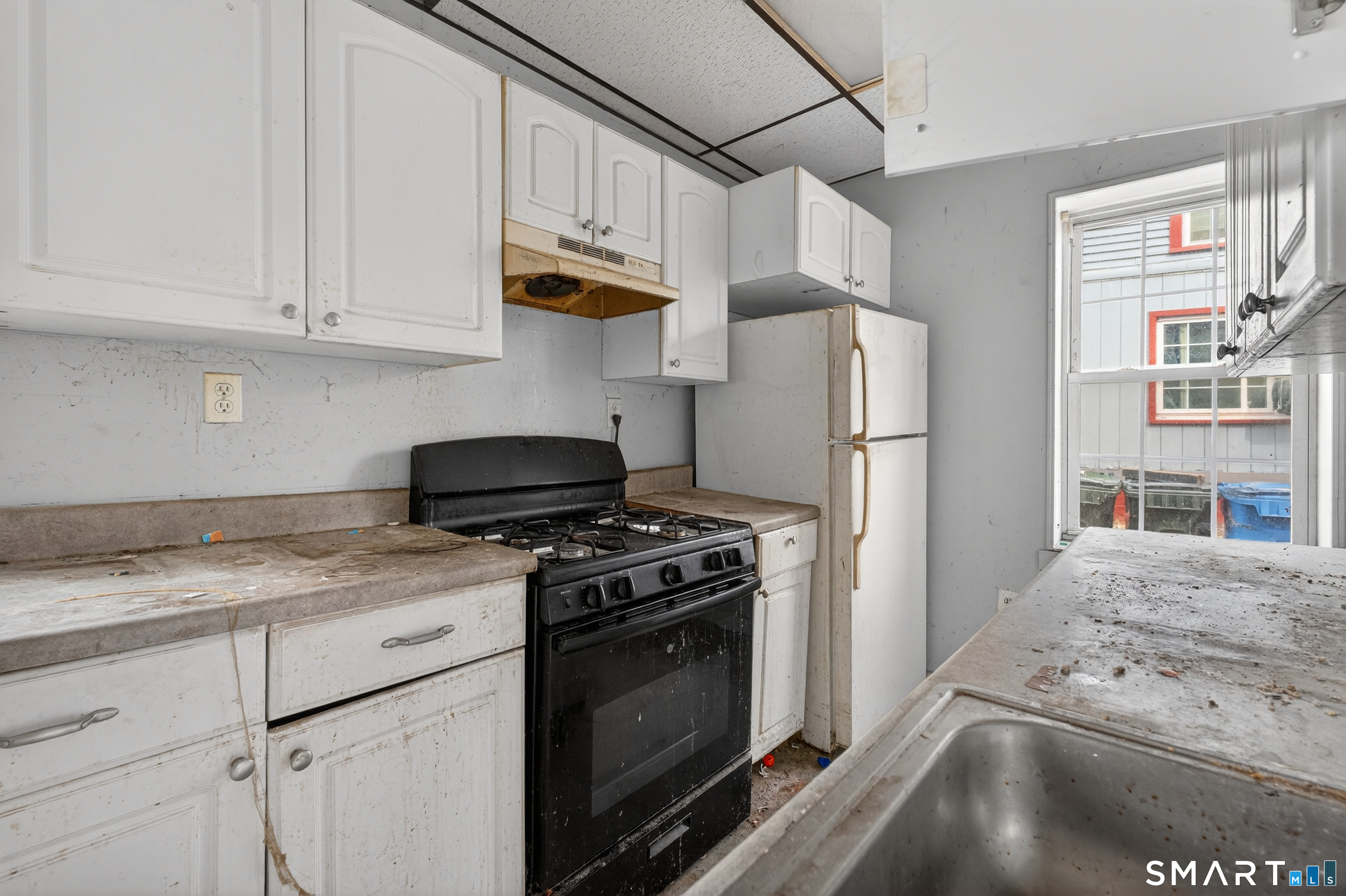 259 Yantic Street Norwich, CT 06360 - Photo 18 of 19 a kitchen with stainless steel appliances granite countertop a stove a refrigerator and a cabinets