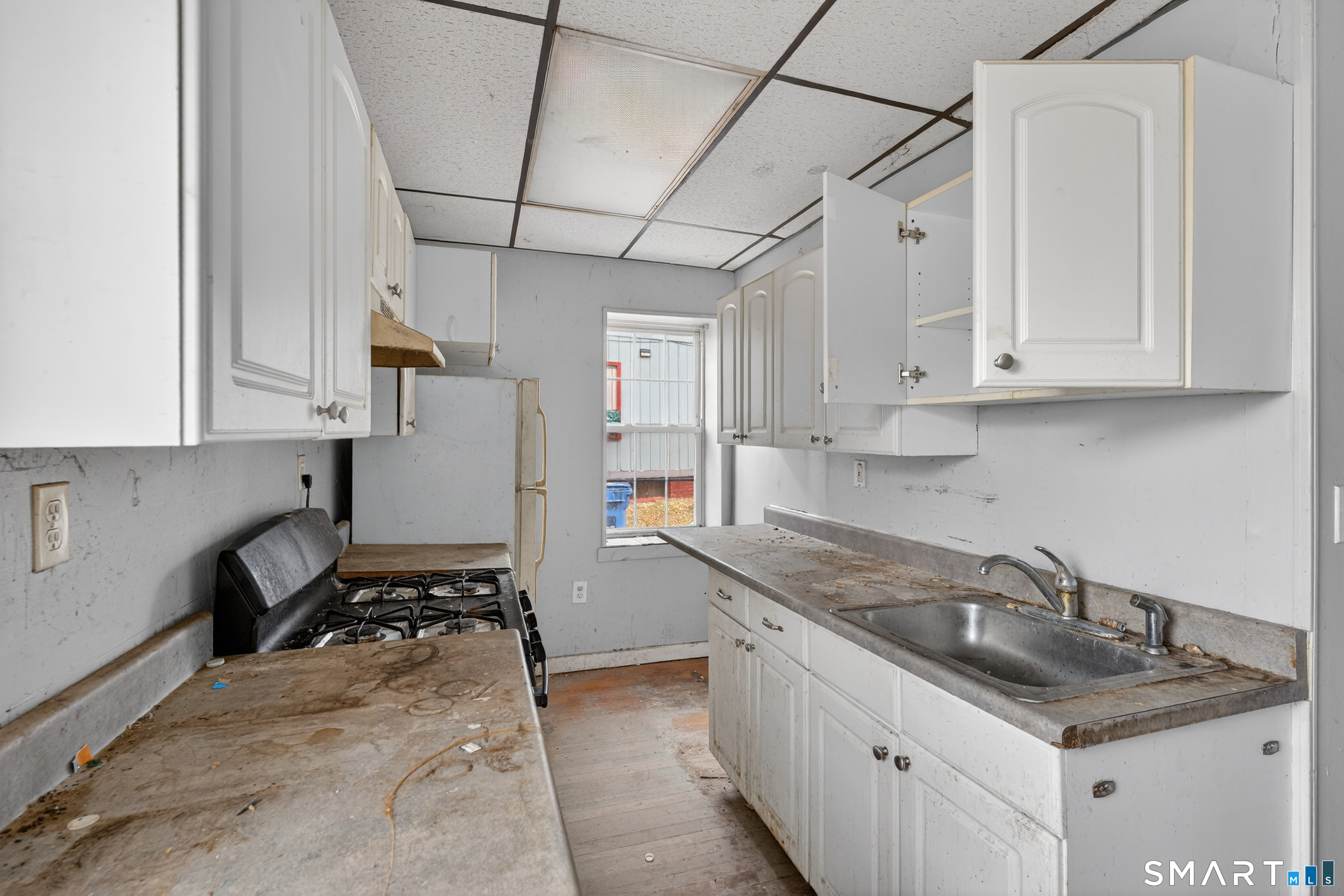 259 Yantic Street Norwich, CT 06360 - Photo 19 of 19 a kitchen that has a sink and a stove
