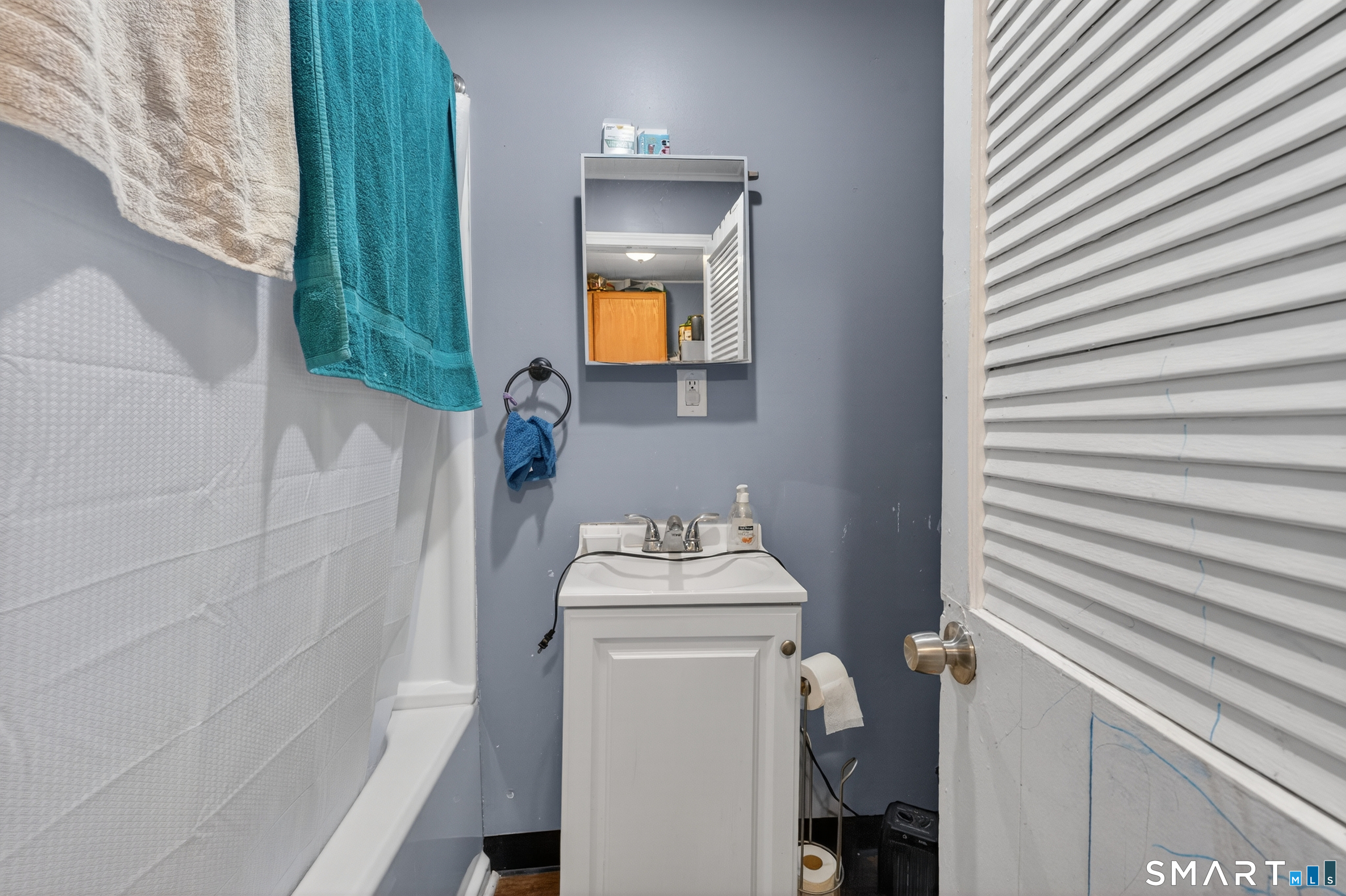 259 Yantic Street Norwich, CT 06360 - Photo 4 of 19 a bathroom with a sink toilet and shower