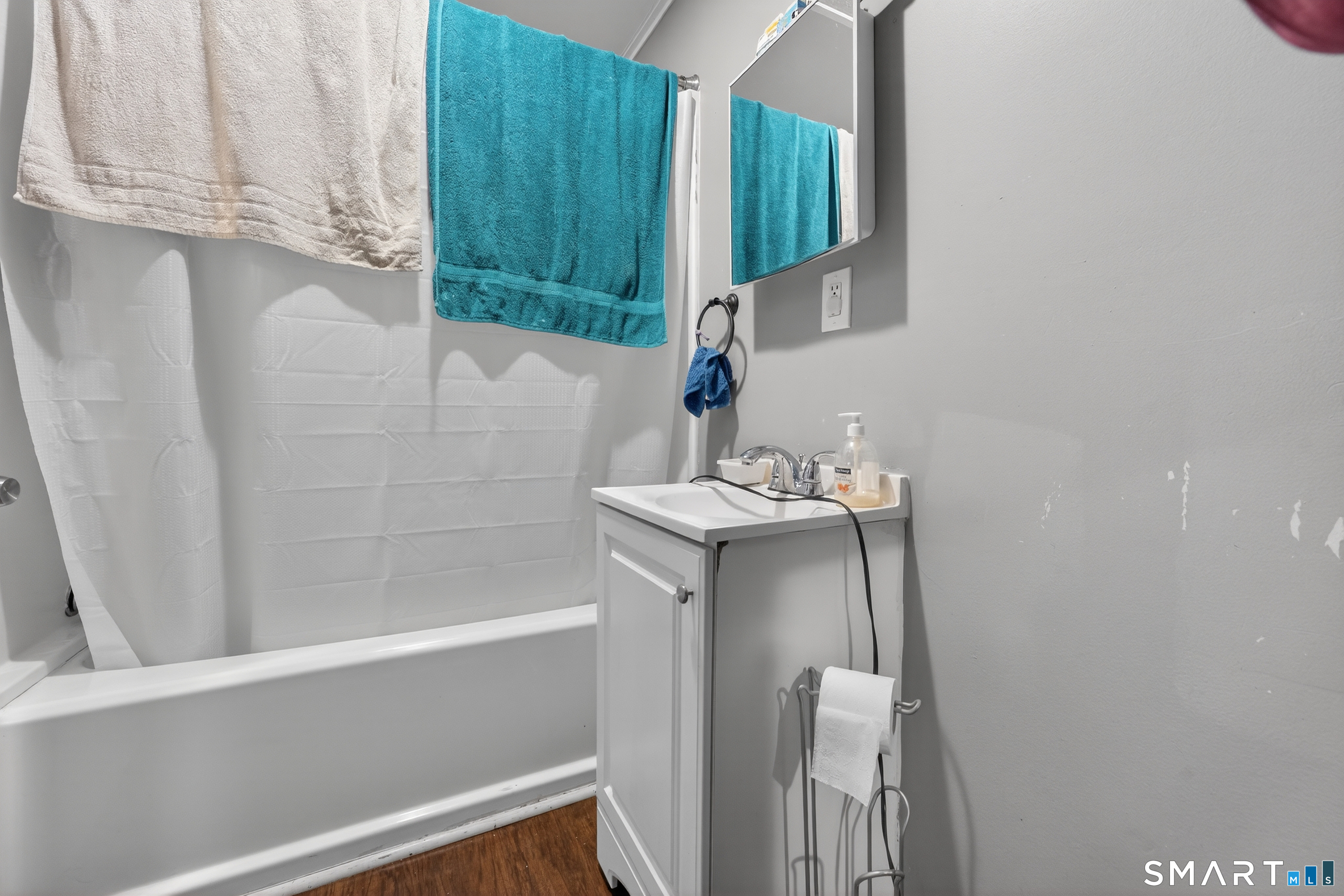259 Yantic Street Norwich, CT 06360 - Photo 5 of 19 a bathroom with a sink and a mirror