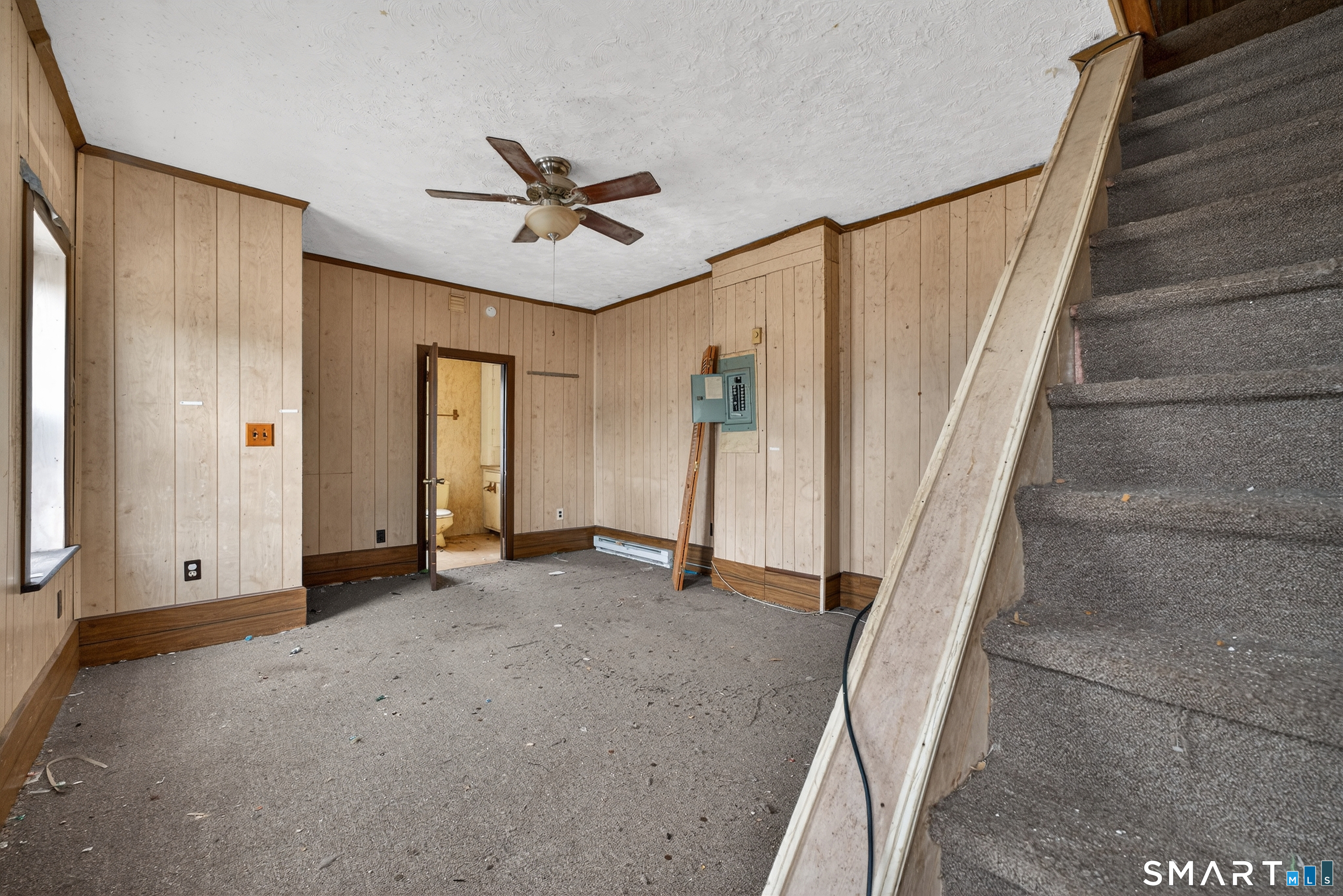 259 Yantic Street Norwich, CT 06360 - Photo 10 of 19 a view of a livingroom with a staircase