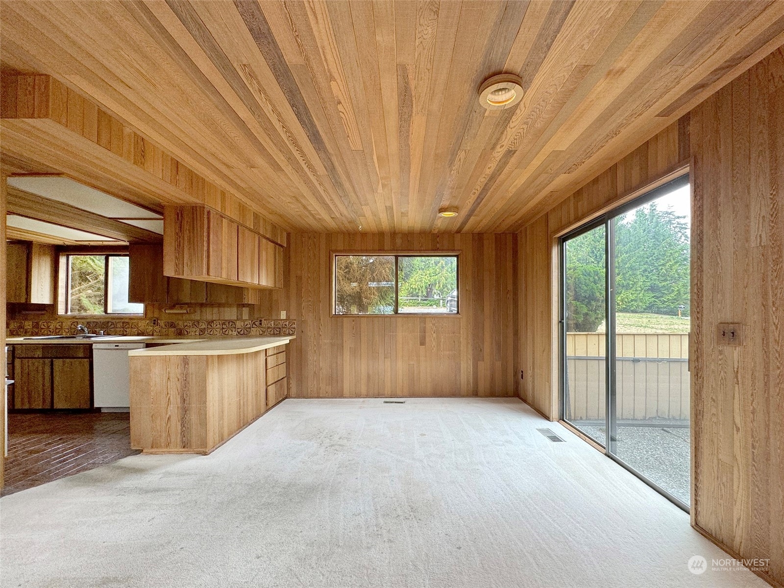 51 Huckleberry Circle Sequim, WA 98382 - Photo 11 of 40 a large kitchen with stainless steel appliances granite countertop a sink window and cabinets