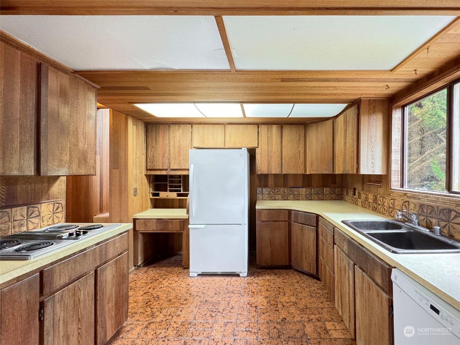 51 Huckleberry Circle Sequim, WA 98382 - Photo 14 of 40 a kitchen with stainless steel appliances granite countertop a sink stove and refrigerator