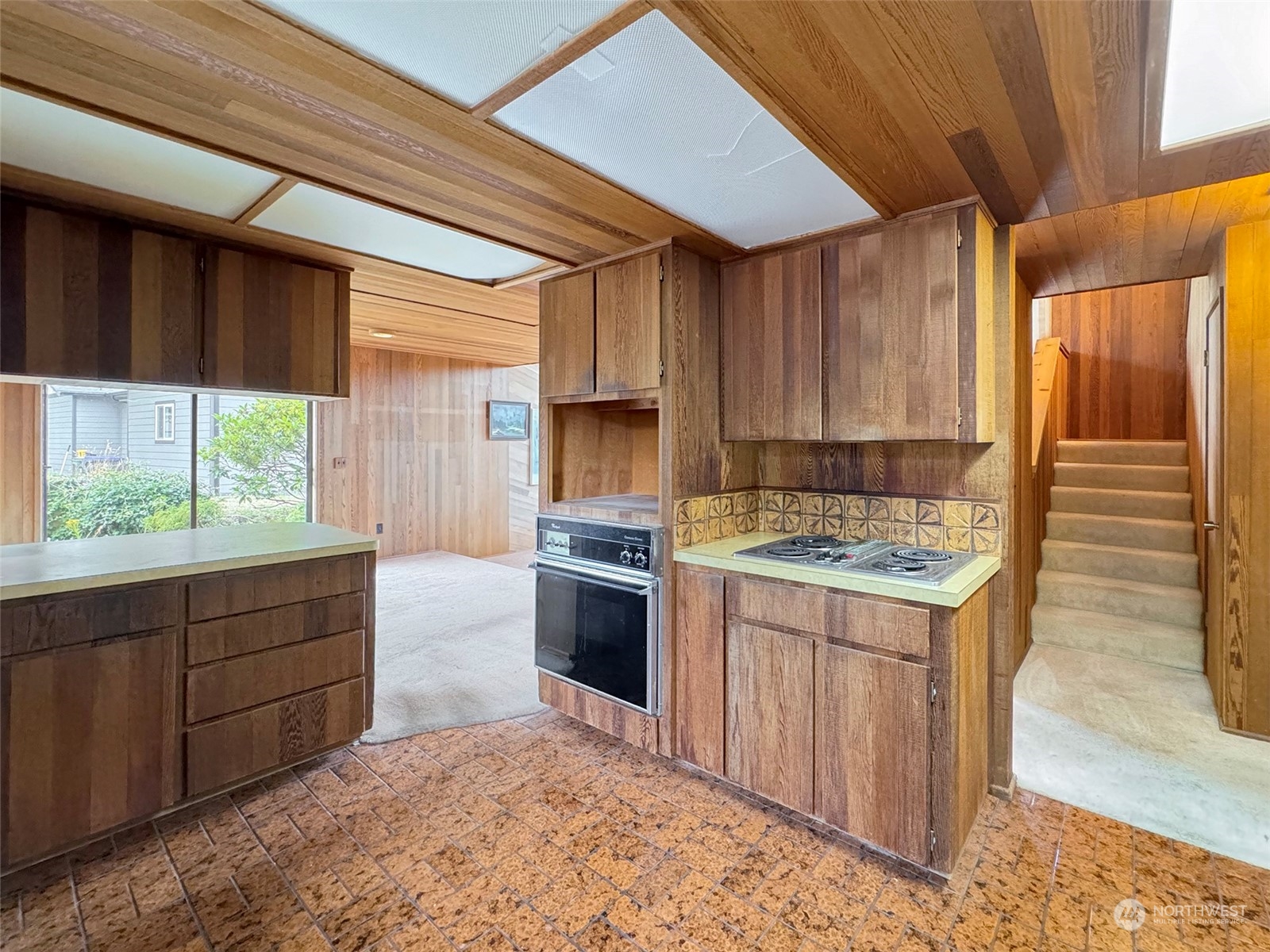 51 Huckleberry Circle Sequim, WA 98382 - Photo 15 of 40 a kitchen with a stove sink and cabinets