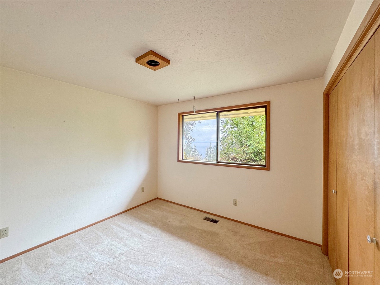 51 Huckleberry Circle Sequim, WA 98382 - Photo 25 of 40 an empty room with windows