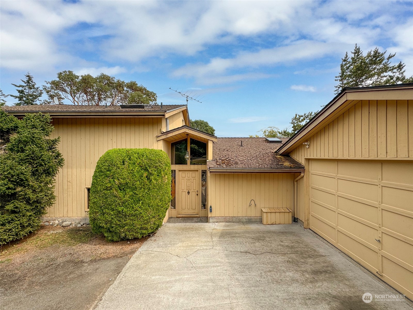 51 Huckleberry Circle Sequim, WA 98382 - Photo 4 of 40 a view of a house with a garden