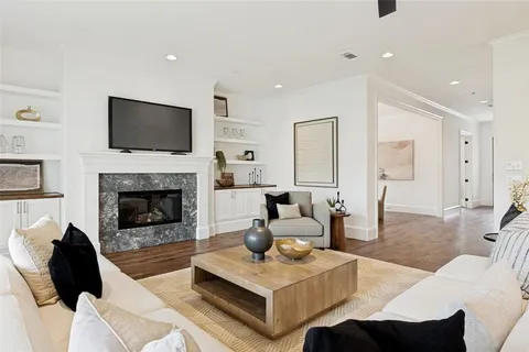 a living room with furniture fireplace and a flat screen tv