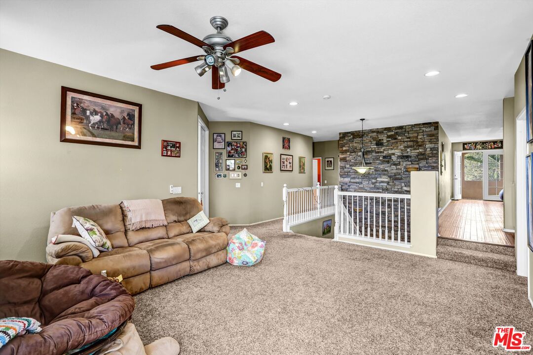 24383 Topacio Court Wildomar, CA 92595 - Photo 17 of 39 a living room with furniture and a ceiling fan