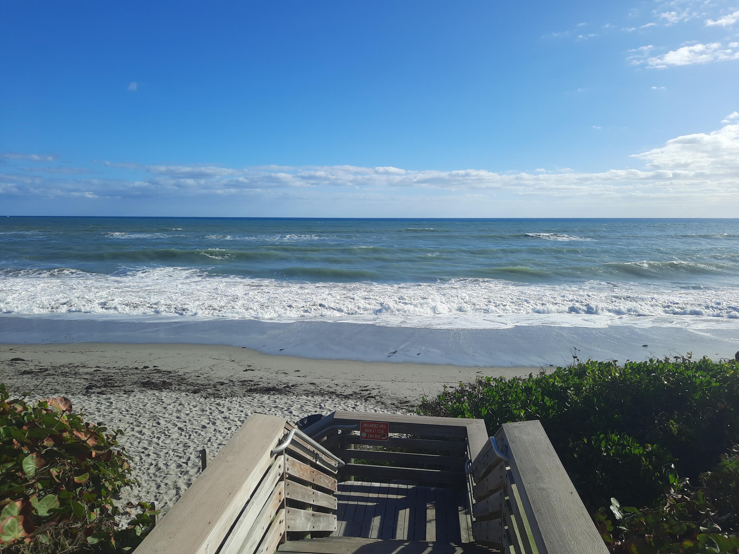 708 Mainsail Circle Jupiter, FL 33477 - Photo 17 of 68 a view of a terrace with wooden floor and a yard