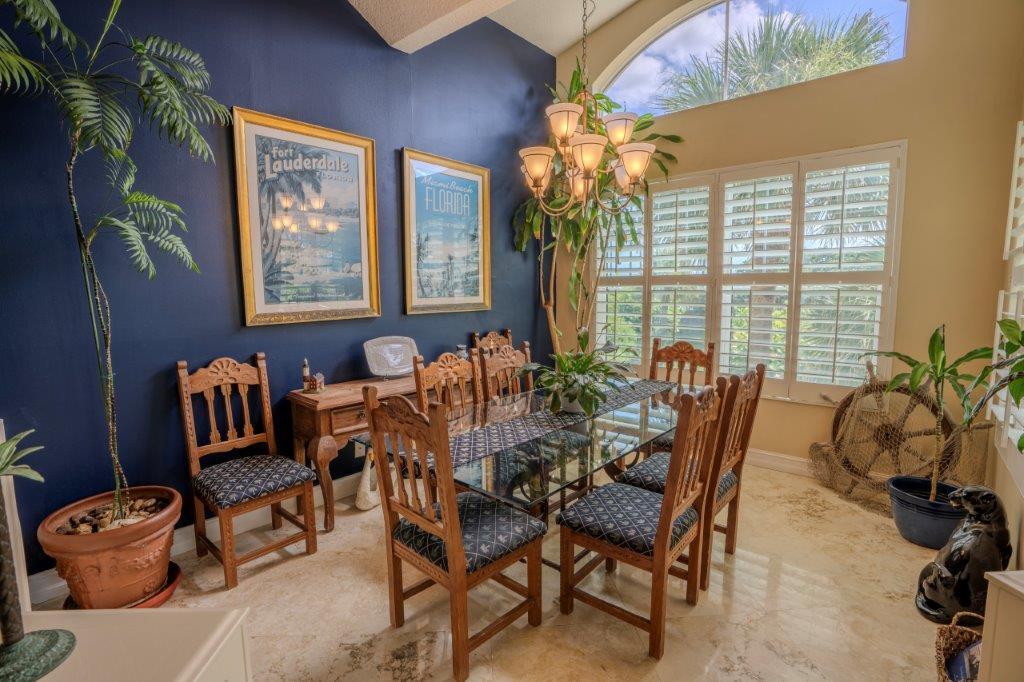 708 Mainsail Circle Jupiter, FL 33477 - Photo 22 of 68 a view of a dining room with furniture window and outside view