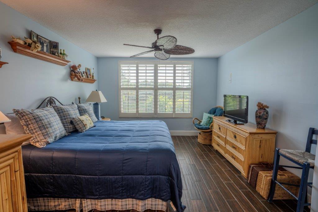 708 Mainsail Circle Jupiter, FL 33477 - Photo 33 of 68 a bedroom with a bed and a television