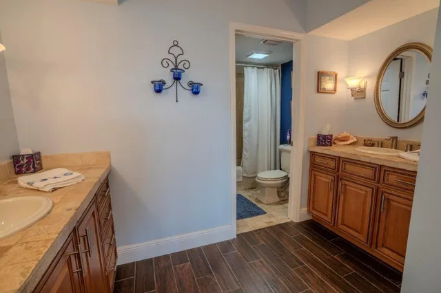 a view of a balcony with chair and potted plants