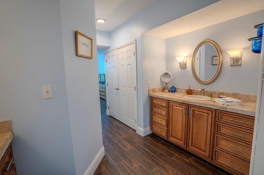 708 Mainsail Circle Jupiter, FL 33477 - Photo 37 of 68 a bathroom with a double vanity sink and a mirror