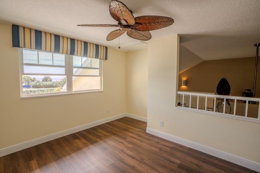 708 Mainsail Circle Jupiter, FL 33477 - Photo 42 of 68 a view of an empty room with a window and wooden floor