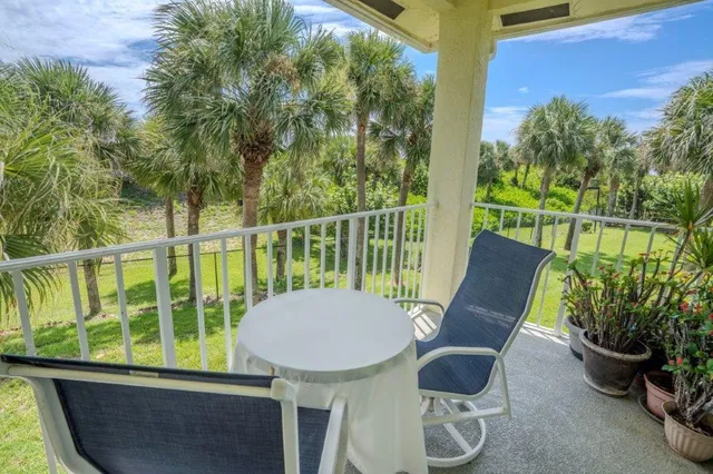 a front view of a house with yard patio and dining space