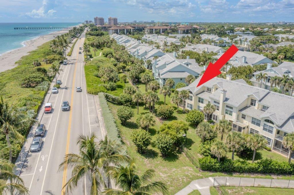 708 Mainsail Circle Jupiter, FL 33477 - Photo 6 of 68 an aerial view of a house with a yard and lake