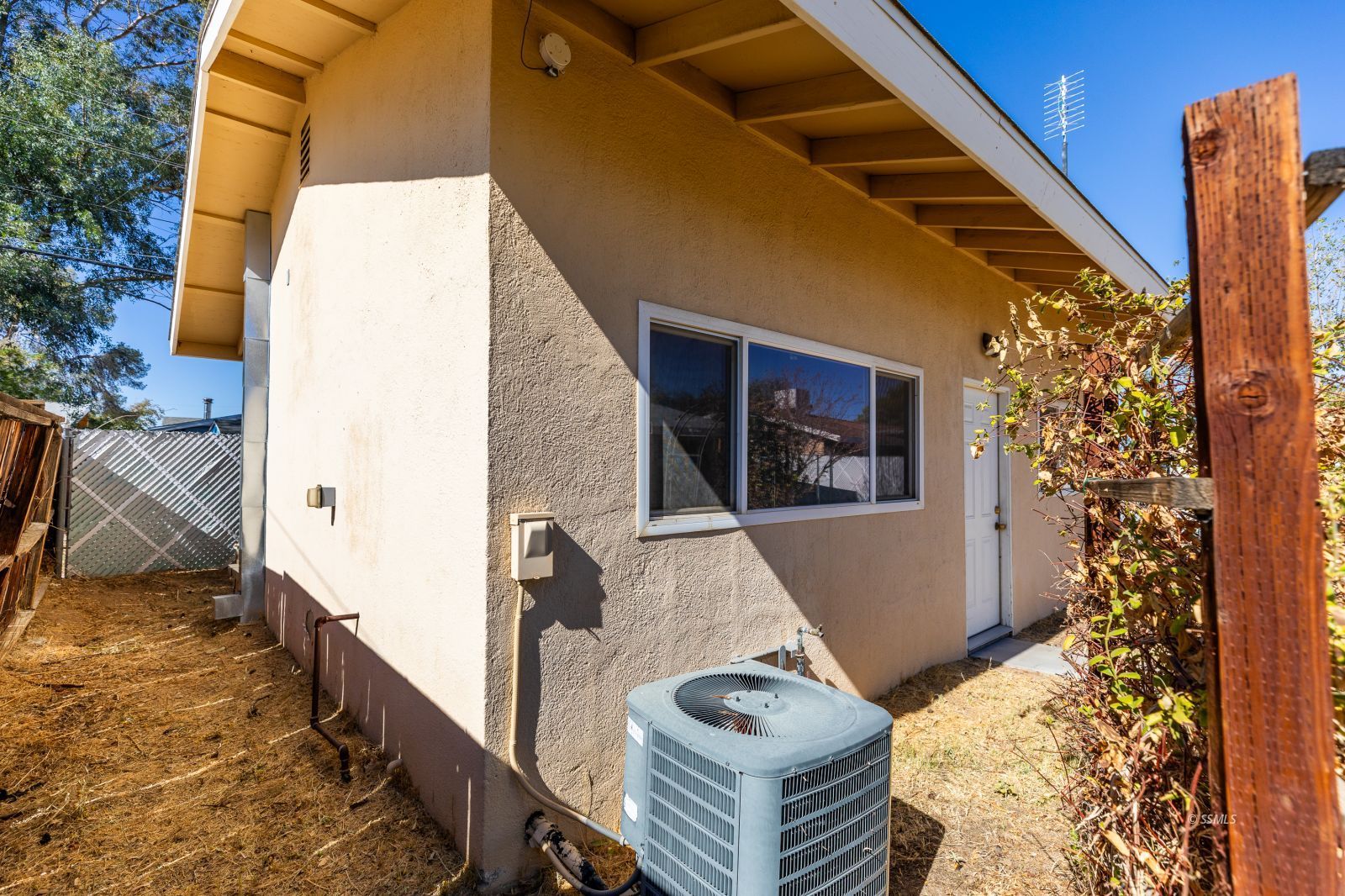 247 North Norma Street Ridgecrest, CA 93555 - Photo 28 of 31 a view of a house with backyard and trees