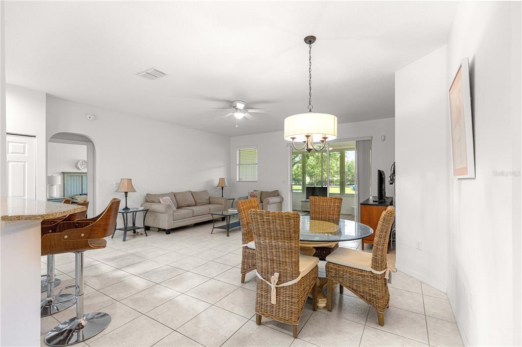 9317 Southwest 94th Loop Ocala, FL 34481 - Photo 7 of 40 a view of a dining room with furniture window and outside view