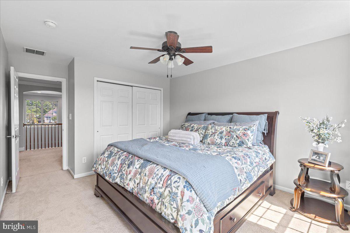 2650 Valhalla Road Vineland, NJ 08361 - Photo 27 of 49 a bedroom with a bed and a chandelier