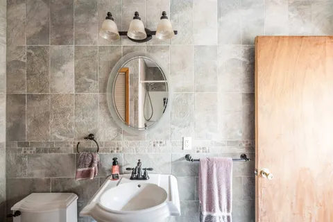 a bathroom with a sink and a mirror