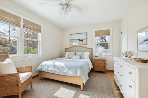 a bedroom with a bed and a couch