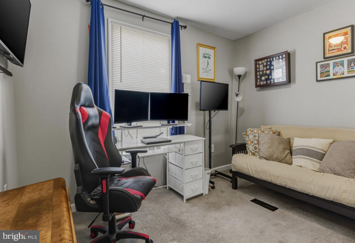 27 Lincoln Drive Clementon, NJ 08021 - Photo 29 of 31 a living room with furniture a flat screen tv and a window