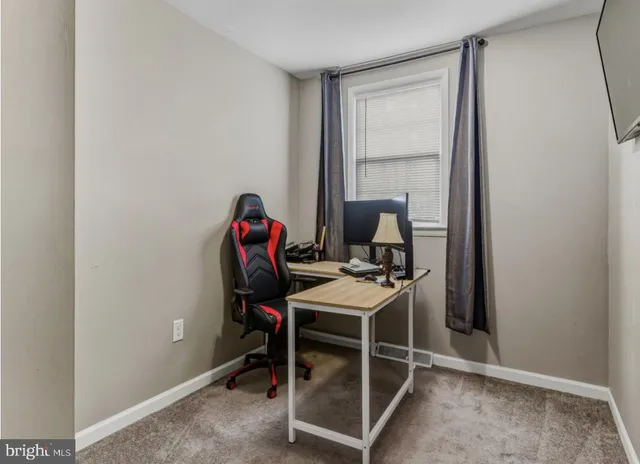 a workspace with furniture and window