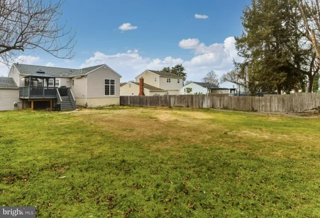 a swimming pool with outdoor seating and yard