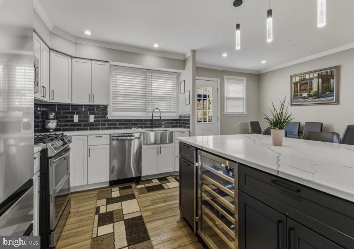 27 Lincoln Drive Clementon, NJ 08021 - Photo 8 of 31 a kitchen with a sink stainless steel appliances and cabinets