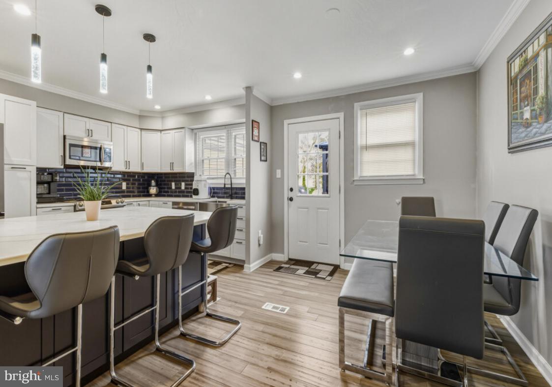 27 Lincoln Drive Clementon, NJ 08021 - Photo 9 of 31 a living room with stainless steel appliances kitchen island granite countertop furniture and a refrigerator