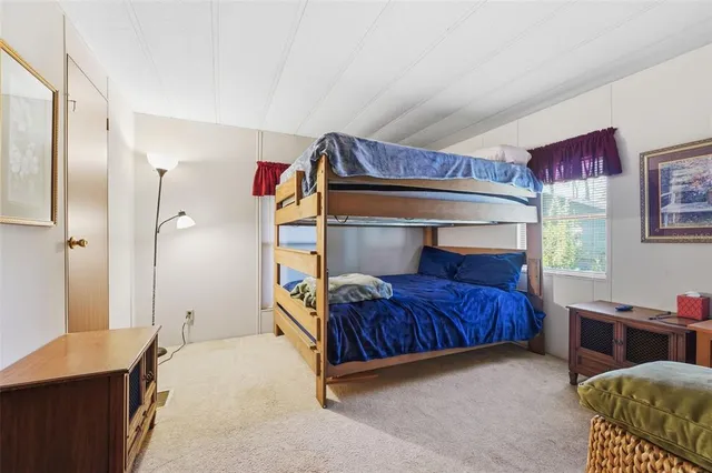 a bedroom with a bed and a closet