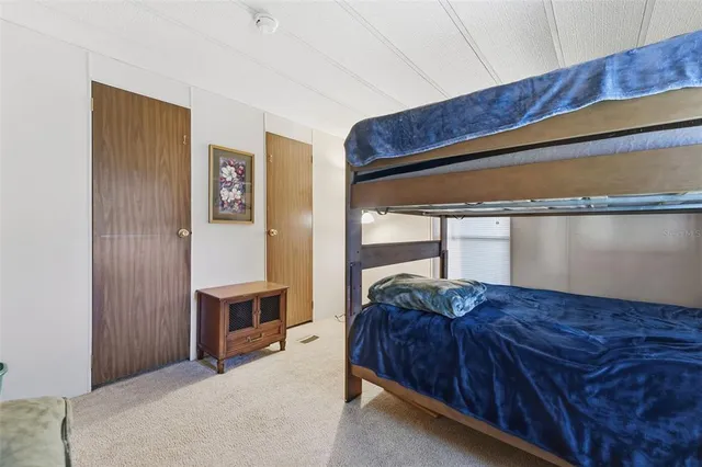 a living room with a bed and furniture