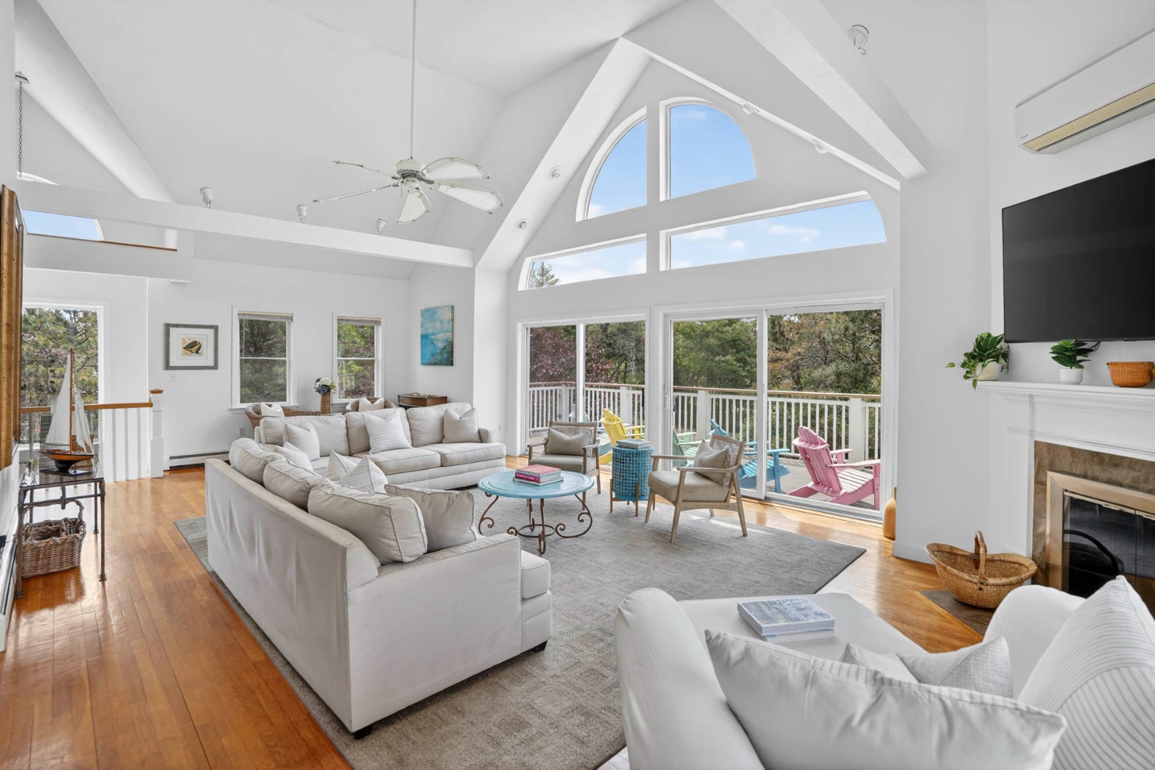 9 Thaxter Lane Edgartown, MA 02539 - Photo 7 of 53 a living room with furniture a flat screen tv and a fireplace