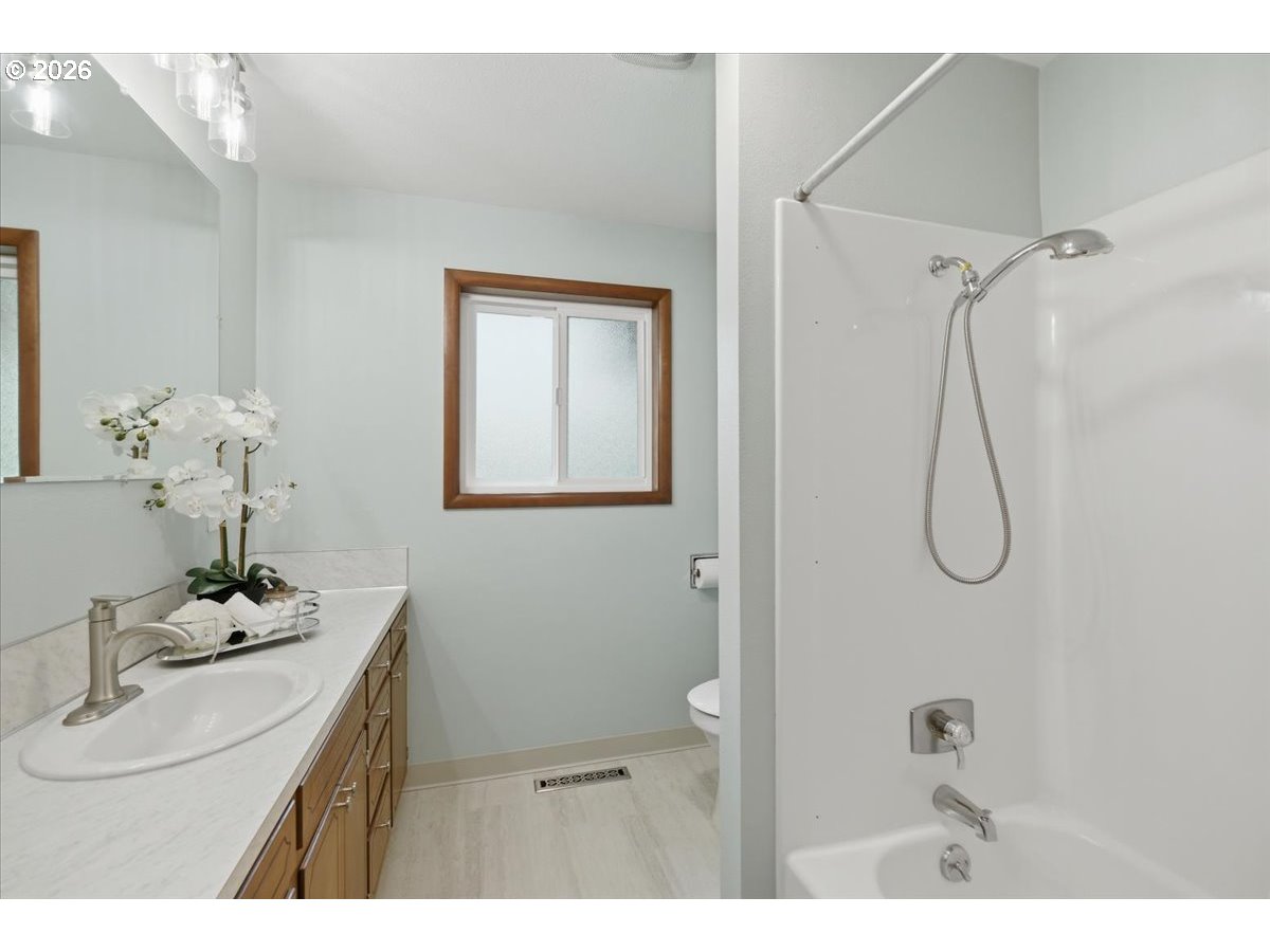 2610 Shaff Road Southeast Aumsville, OR 97325 - Photo 14 of 25 a bathroom with a sink vanity granite and shower